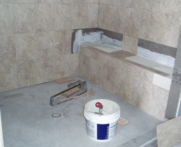 how to install a shower base on concrete floor