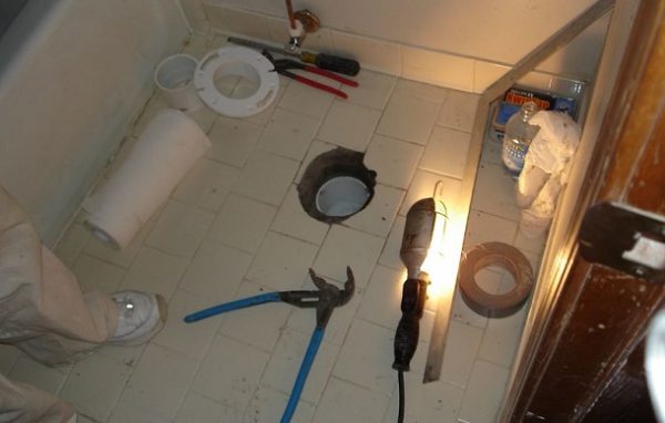 How to install a toilet flange in new construction on a tile floor